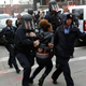 A demonstrator protesting the shooting death of Michael Brown is arrested by police officers in riot gear Nov. 30, 2014, in St. Louis, Mo.